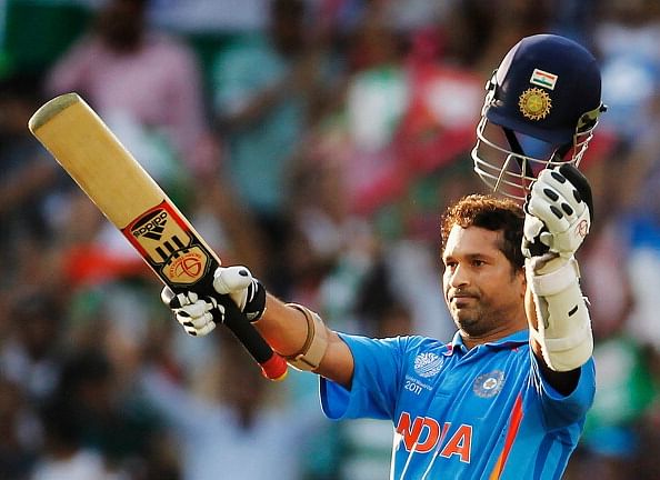 NAGPUR, INDIA - MARCH 12: Sachin Tendulkar of India raises his bat on scoring his century during the Group B ICC World Cup Cricket match between India and South Africa at Vidarbha Cricket Association Ground on March 12, 2011 in Nagpur, India.
